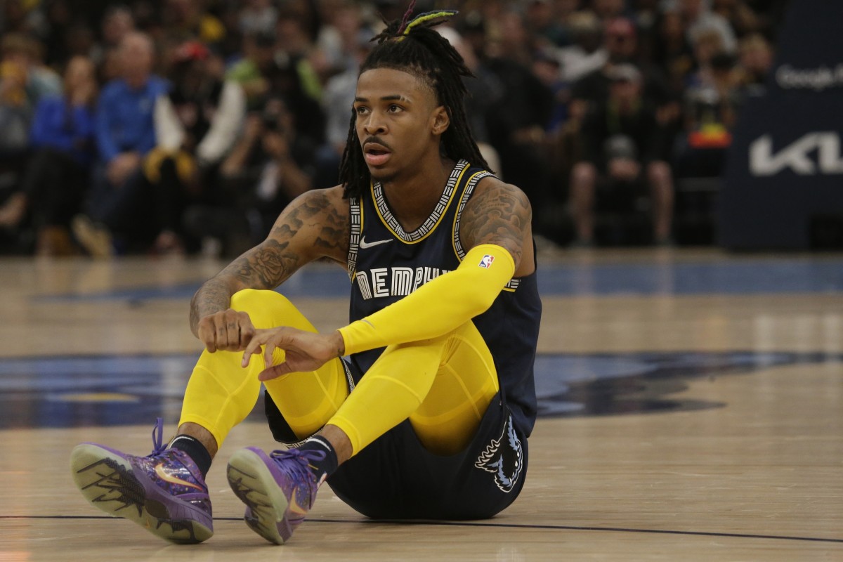 May 3, 2022; Memphis, Tennessee, USA; Memphis Grizzlies guard Ja Morant (12) sits on the court during the first half in game two of the second round for the 2022 NBA playoffs against the Golden State Warriors at FedExForum. Mandatory Credit: Petre Thomas-USA TODAY Sports